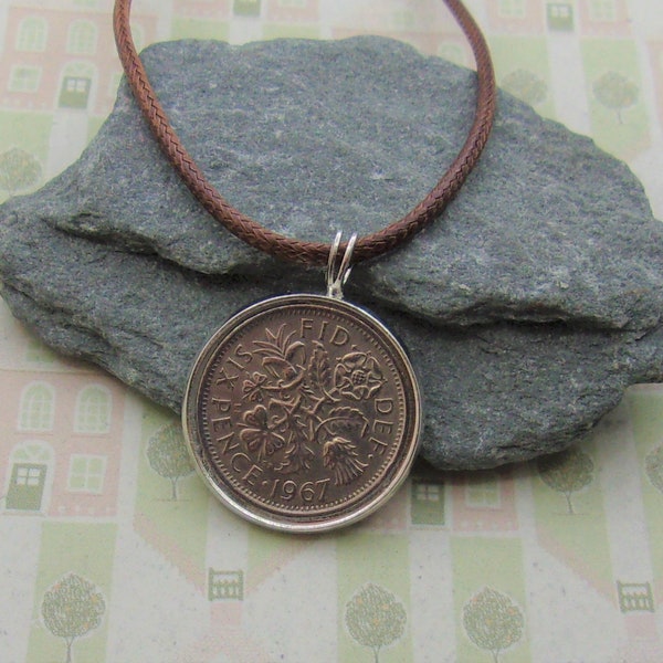 U.K. Sixpence  Coin in a pendant and hung from a braided necklace