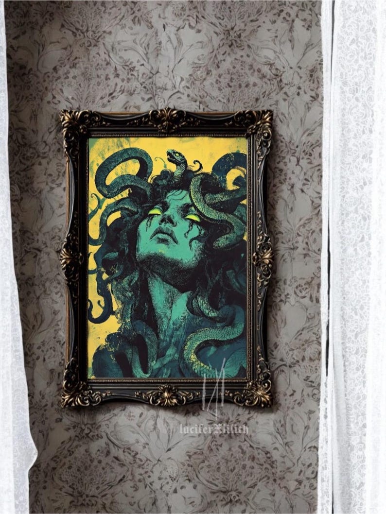 May include: A framed print depicting a woman with snakes for hair. The woman has green skin and her eyes are glowing green. The background is yellow with a grunge texture. The print is framed in a dark brown ornate frame.