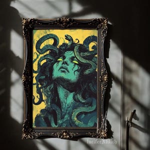 May include: A framed illustration of Medusa, a mythical Greek figure with snakes for hair, depicted with a green face and yellow eyes. The background is a yellow-green colour.