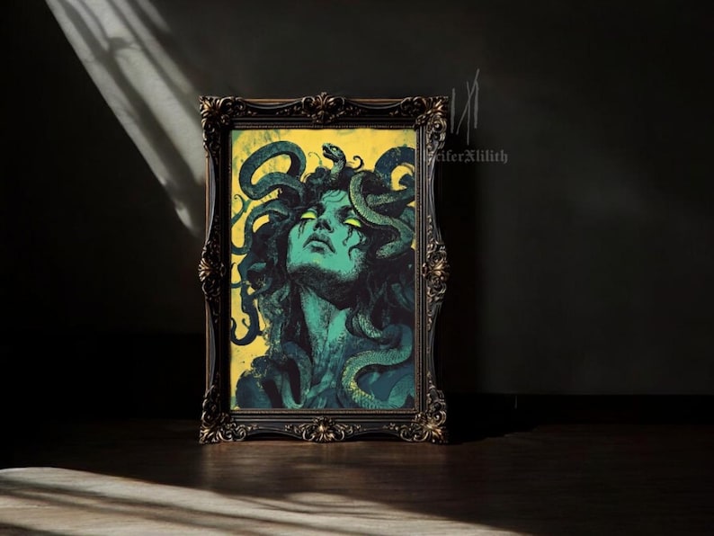 May include: A framed print of a woman with green hair and eyes, surrounded by snakes. The background is yellow and the frame is ornate and black.