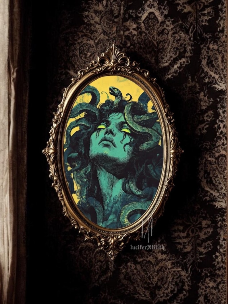 May include: A vintage-style oval mirror with a gold frame, featuring a painting of Medusa, a mythical Greek figure with snakes for hair, against a yellow background. The text "luciferxlilith" is visible at the bottom of the image.