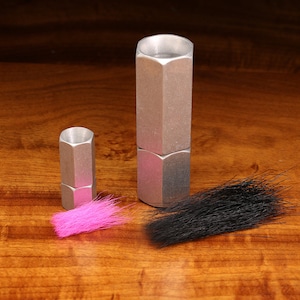 May include: Two silver metal fly tying tools with black and pink fly tying materials.