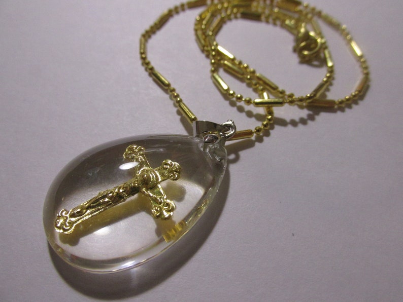 Gold Foil Cross with Jesus Charm in Acrylic Teardrop Pendant with Gold Tone Chain 16