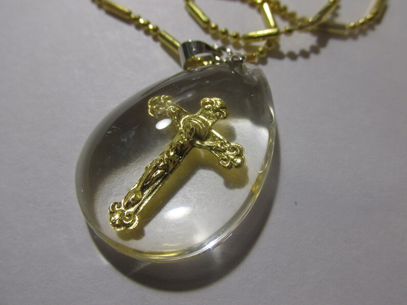 Gold Foil Cross with Jesus Charm in Acrylic Teardrop Pendant with Gold Tone Chain 16