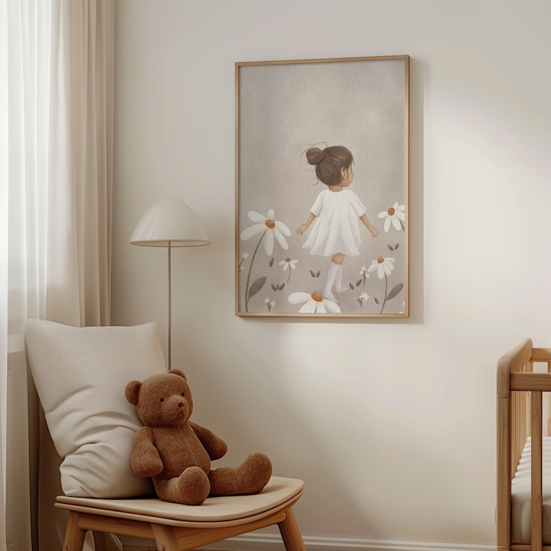 May include: A framed art print depicts a child in a white dress walking through a field of large daisies. The artwork has a neutral color palette with a light brown wooden frame. A brown teddy bear sits on a wooden chair.