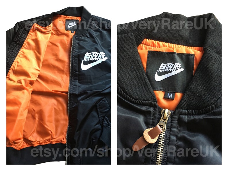 orange nike hoodie with japanese writing