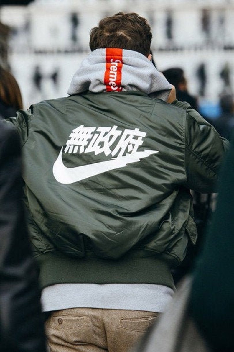 orange nike hoodie with japanese writing