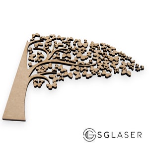 May include: A wooden cutout of a tree with a brown trunk and branches, decorated with numerous butterfly shapes. The tree is leaning to the right, creating a dynamic and whimsical design.