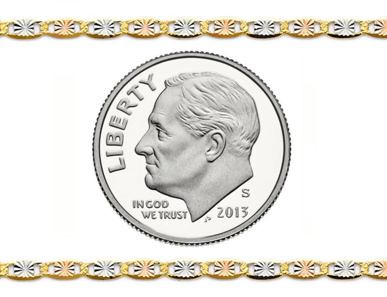 May include: A gold-toned chain with alternating white, rose, and yellow gold accents. A U.S. dime coin is in the center, showing the profile of a man and the words "Liberty" and "In God We Trust". The coin is dated 2013.