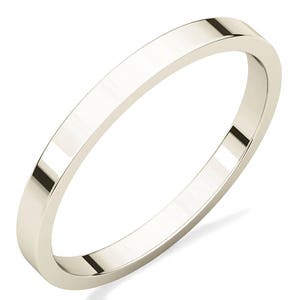 May include: A simple, polished, silver wedding band with a flat, slightly rounded profile.