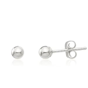 May include: A pair of silver ball stud earrings. The earrings are simple and classic, and they would make a great gift for any occasion.