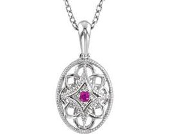 May include: A silver pendant necklace featuring a pink gemstone set within an intricate, oval-shaped design.