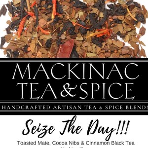 May include: A wellness tea blend called "Mackinac Tea & Spice" with a tagline "Seize The Day!!!" and the description "Toasted Mate, Cocoa Nibs & Cinnamon Black Tea". The image shows a close-up of the tea blend, which includes black tea, mate, cocoa nibs, and cinnamon.
