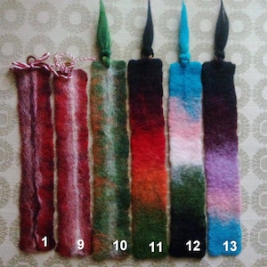 May include: Seven colorful wool bookmarks with ombre dyeing. The bookmarks are numbered 1, 9, 10, 11, 12, and 13.