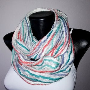 May include: A white infinity scarf with stripes of teal, pink, and purple.