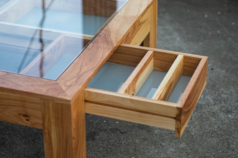 Glass and wood coffee table with drawers and hidden compartments image 5