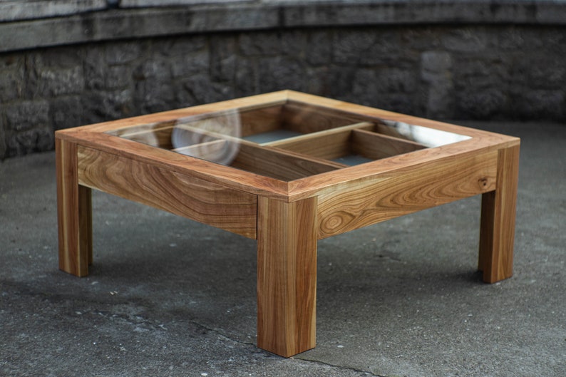 Glass and wood coffee table with drawers and hidden compartments image 1