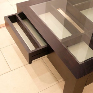 Glass and wood coffee table with drawers and hidden compartments image 8