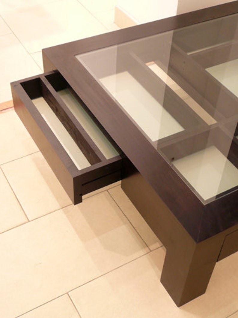 Glass and wood coffee table with drawers and hidden compartments image 8