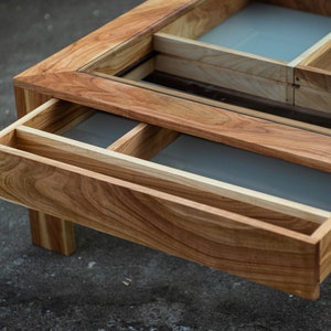 Glass and wood coffee table with drawers and hidden compartments image 4