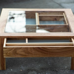 Glass and wood coffee table with drawers and hidden compartments image 6