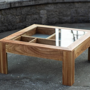 Glass and wood coffee table with drawers and hidden compartments image 2