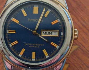 Reloj de pulsera Armitron de cuarzo con día y fecha para hombre que funciona y mantiene la hora