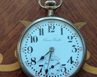 Reloj de bolsillo Langendorf Trans Pacific Swiss antiguo de 21 rubíes, tamaño 16, con caja ornamentada, funcionando y marcando la hora.