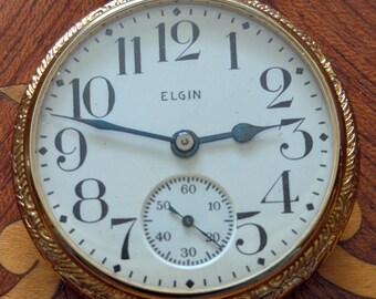 Raro reloj de bolsillo Elgin Ornate Salesman's Father Time. 1917, con solo 1000 unidades producidas. Funciona y mantiene la hora.