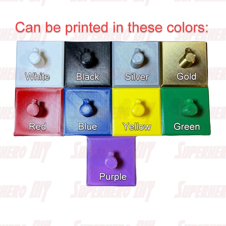 May include: A selection of small, square, 3D printed objects in various colors, including white, black, silver, gold, red, blue, yellow, green, and purple. Each object has a small knob on top.