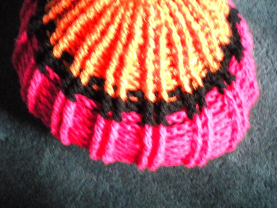 Handmade, crocheted hat, designer model, relief pattern, orange/pink/black, dimensions on request