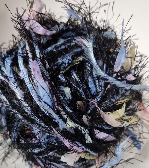 Wool, designer yarn mix, accent yarn/effect yarn/ Papyrus Live, black/pastel, light blue fringed ribbon, hand-wound, vintage wool