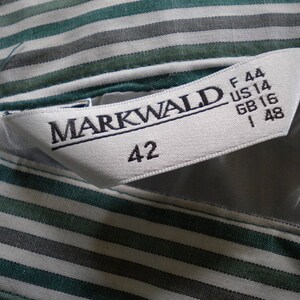 May include: White and green striped fabric with a white label that says "MARKWALD" and has size information: F 44, US 14, GB 16, I 48, and 42.