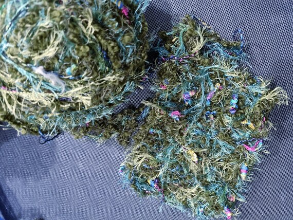 Wool, designer yarn mix, such as patterns, shades of green/Lurex/bobbles/fringes, e.g. for vests, knitted shirts, crocheted tops, hand-wound, vintage wool