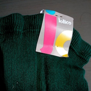 May include: A dark green knitted sweater with a white tag that says "jolico" in black letters.