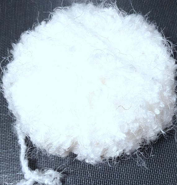 Wool, designer yarn mix, add accents/extra-soft effect yarn/ a dream in white, + various fiber types mixed in, hand-wound, vintage wool