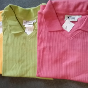 May include: Three ribbed knit polo shirts in yellow, green, and pink. Each shirt has a v-neck and a small tag with the brand name "S.Oliver" on the collar.