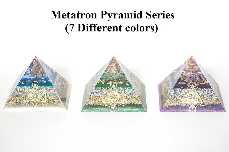 May include: Three Metatron Pyramid Series sculptures in blue, green, and purple. Each pyramid features a copper coil at the apex and a gold-colored geometric design on the base. The text "Metatron Pyramid Series (7 Different colors)" is above the pyramids.