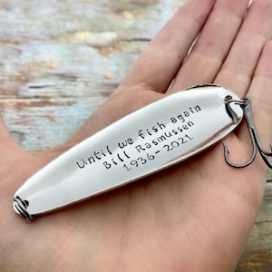 Close-up of hand-stamped lettering on personalized memorial fishing lure keepsake