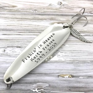 Personalized Fishin’ in Heaven memorial fishing lure with custom name and years, hand-stamped metal keepsake gift. Wing charm add-on.