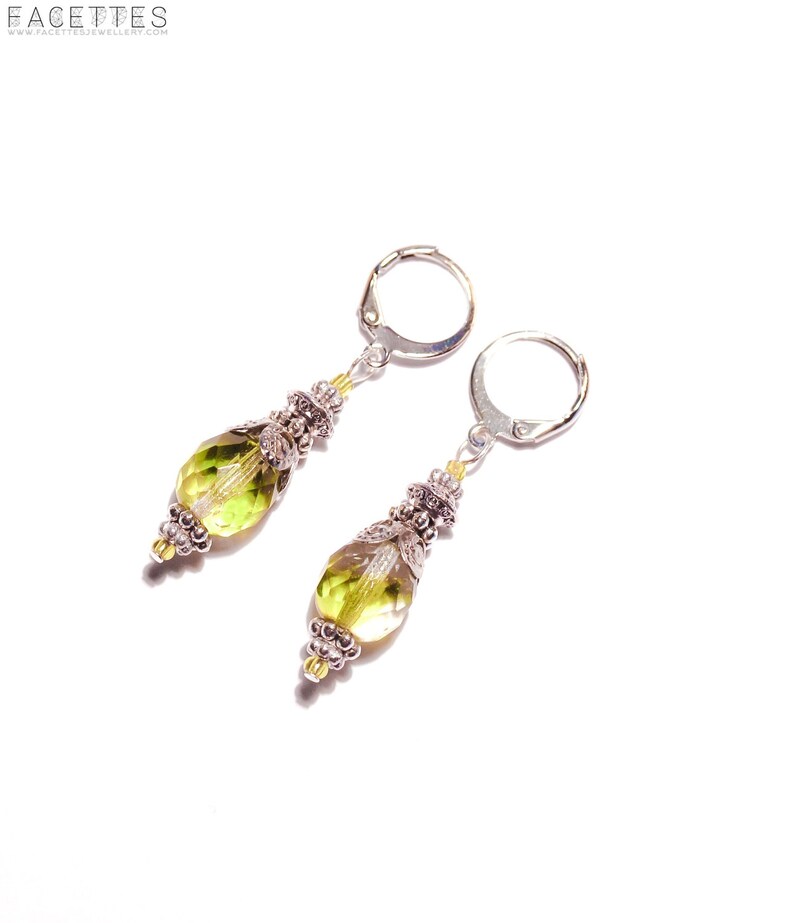 Earrings with large lime green glass beads and silver elements