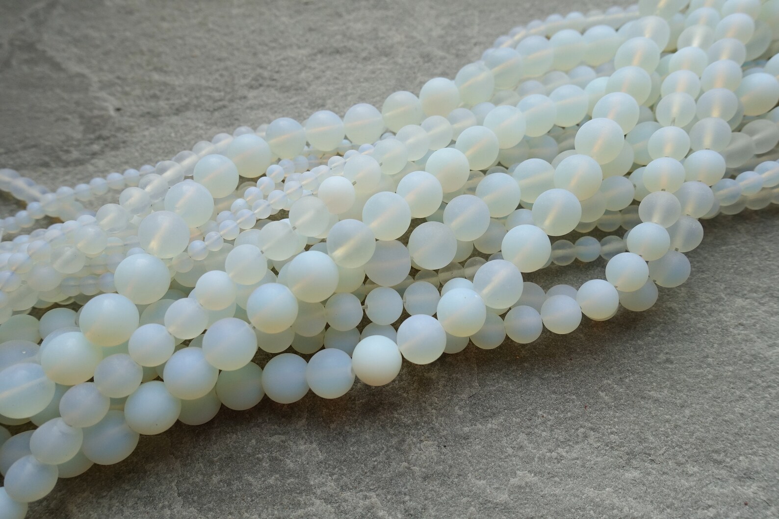 thumbnail image 2 of 10mm Glowing Milky White Opalite Glass Faceted Round Beads – 12 Pieces 2 of 6