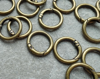 23 mm bronsgeplateerde legering veerpoortringsluiting, verende scharnierende cirkelconnector, knutselbenodigdheden VK
