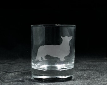 May include: A clear glass tumbler with an etched silhouette of a Cardigan Welsh Corgi dog.