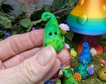 Handmade Bloomkin fairy helper figurine — a whimsical forest creature holding a magical flower