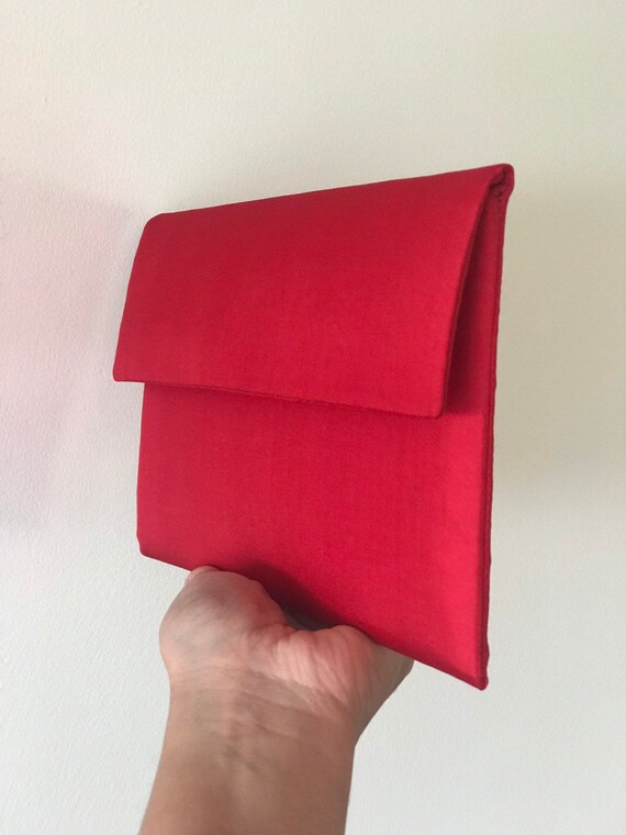 bright red clutch bag