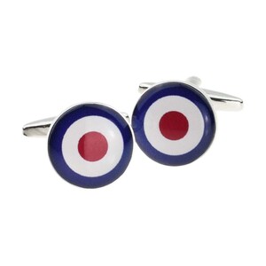 May include: A pair of silver cufflinks with a blue, white, and red target design.