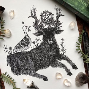 May include: Black and white line art print of a goat with a pentagram and candles on its antlers. A bird is perched on the goat's back. The print is surrounded by flowers.