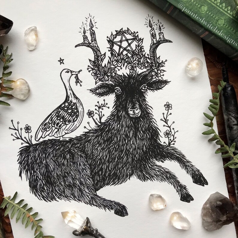 May include: Black and white line art print of a goat with a pentagram and candles on its antlers. A bird is perched on the goat's back. The print is surrounded by flowers.