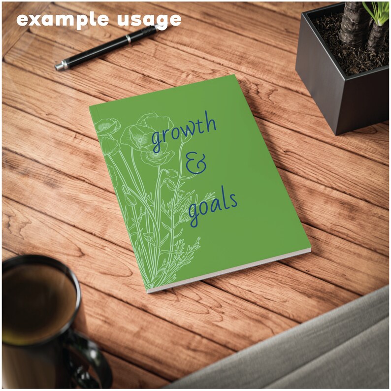 May include: Green notebook with white poppy flower illustrations and the text "growth & goals" in blue.